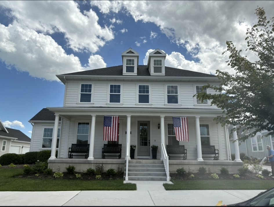 Two-story home exterior painted white by EC Painting LLC in Utah